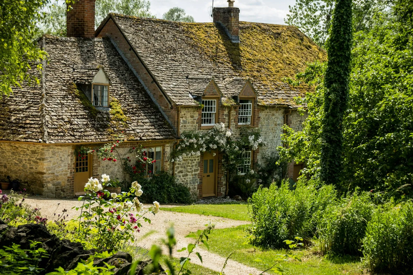A rural stone cottage in the English countryside — the kind of property that typically relies on private drainage