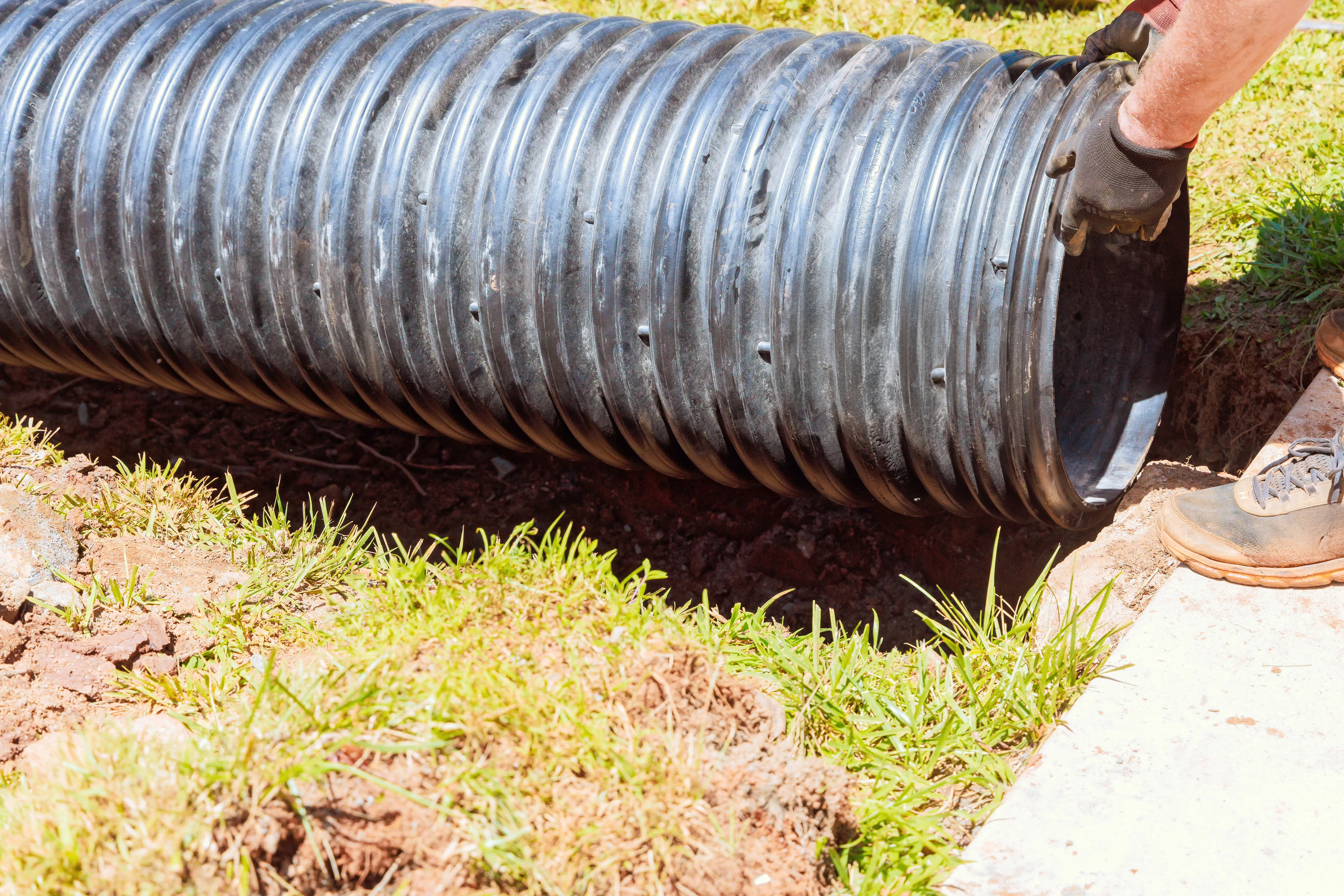 A drainage pipe being installed as part of a repair